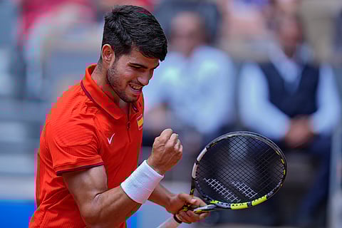 Carlos Alcaraz reacts after scoring a point against Felix Auger-Aliassime